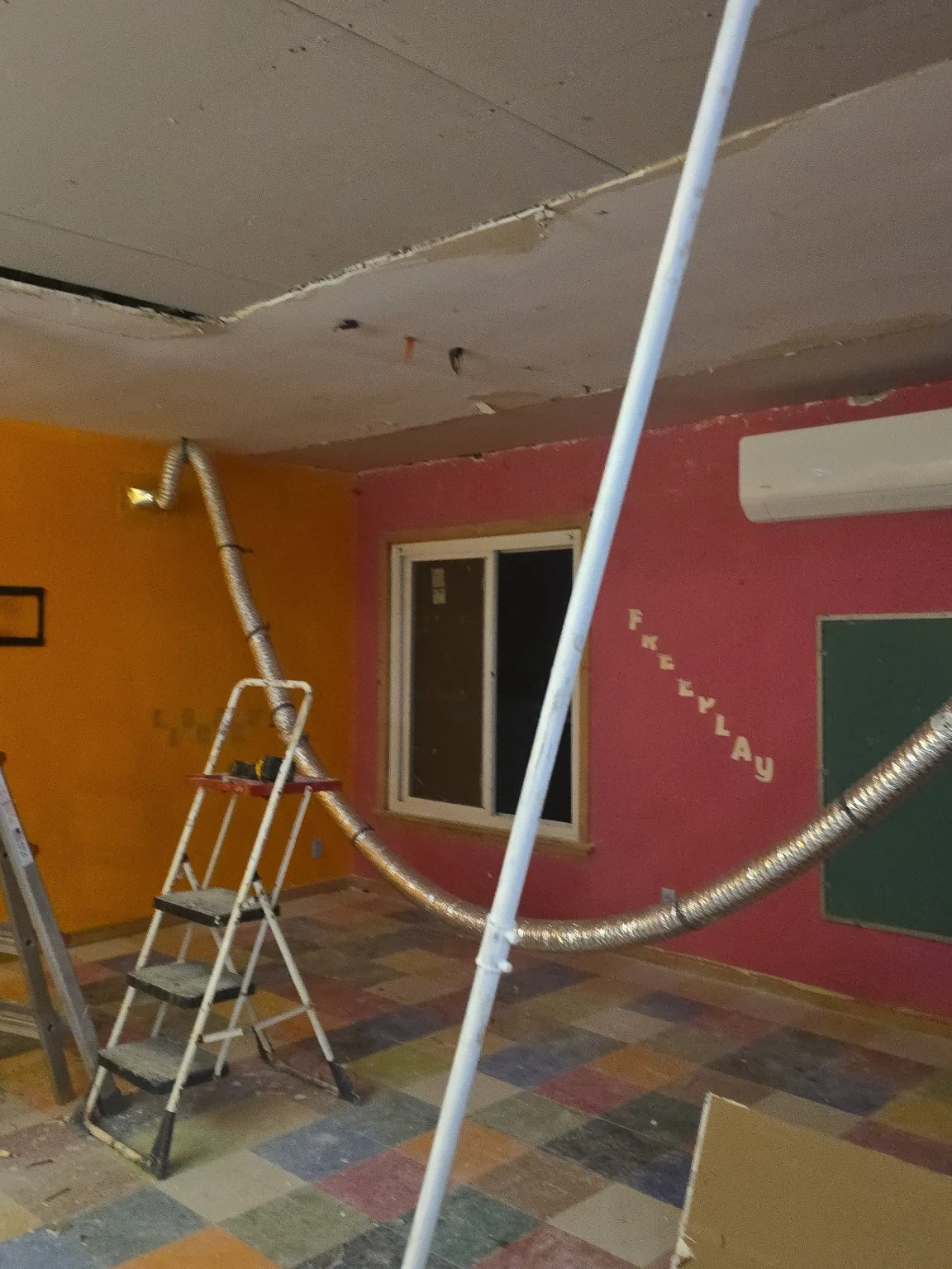 Interior room with ladders, multicolor floor and ceiling work area