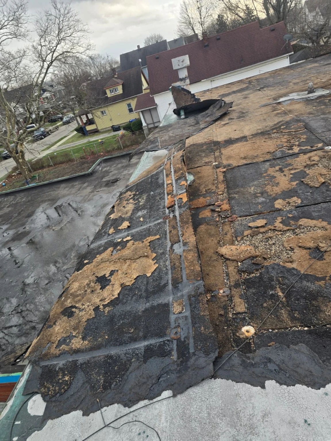 Flat roof with exposed areas during roofing work